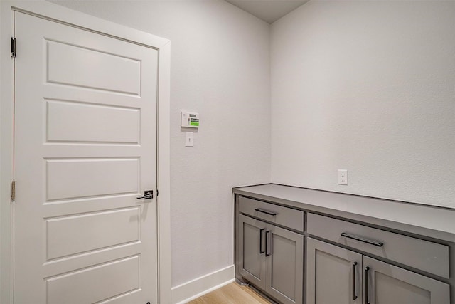 interior space with light wood-style flooring and baseboards