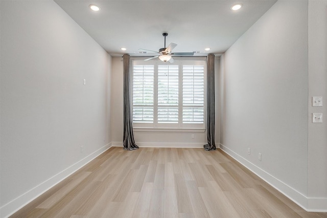 empty room featuring baseboards, light wood-type flooring, recessed lighting, and a ceiling fan