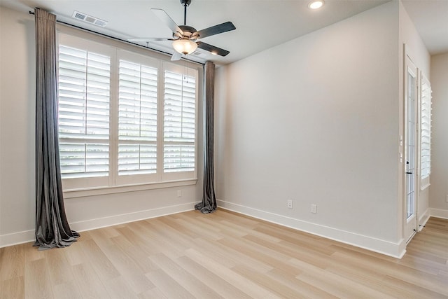 spare room featuring visible vents, baseboards, ceiling fan, recessed lighting, and wood finished floors