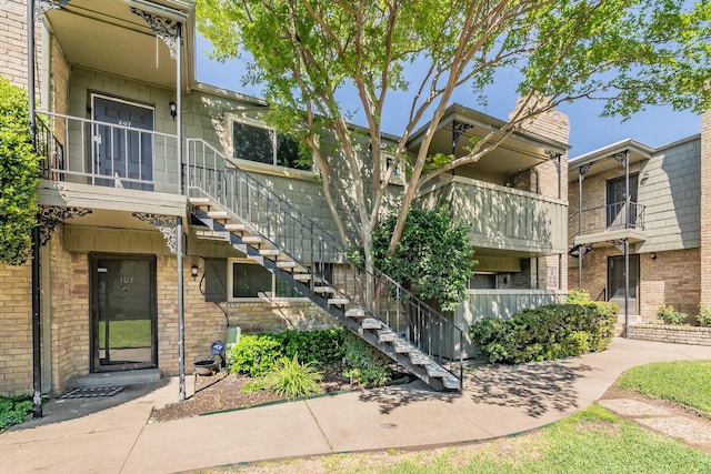 view of property featuring stairs