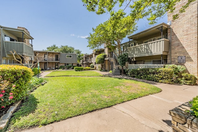 surrounding community featuring a residential view and a yard