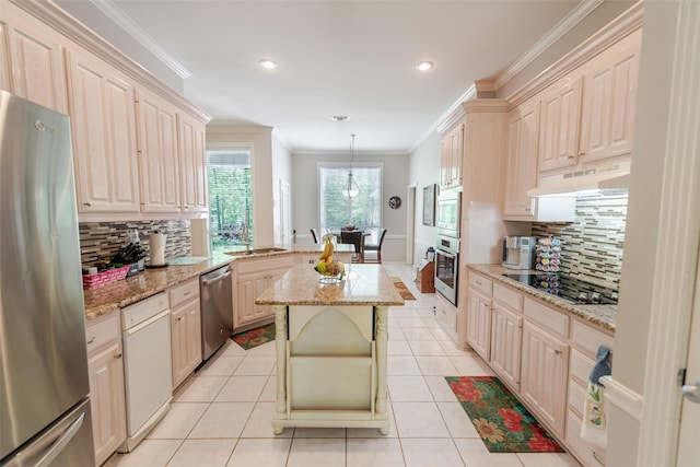kitchen featuring crown molding, appliances with stainless steel finishes, decorative backsplash, and under cabinet range hood