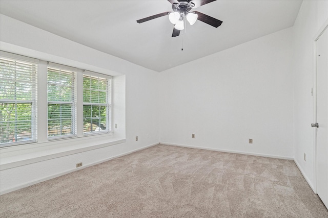 unfurnished room featuring ceiling fan, baseboards, and light carpet