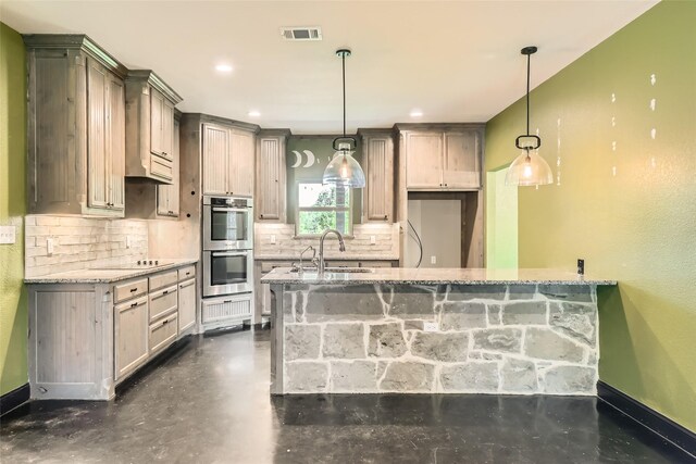 2001 Ryan Ct, Weatherford, TX 76085 - kitchen featuring light stone countertops, decorative backsplash, visible vents, a sink, and stainless steel double oven