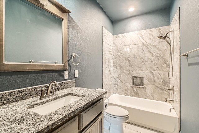 2001 Ryan Ct, Weatherford, TX 76085 - bathroom with a textured wall, vanity, shower / bathing tub combination, and toilet