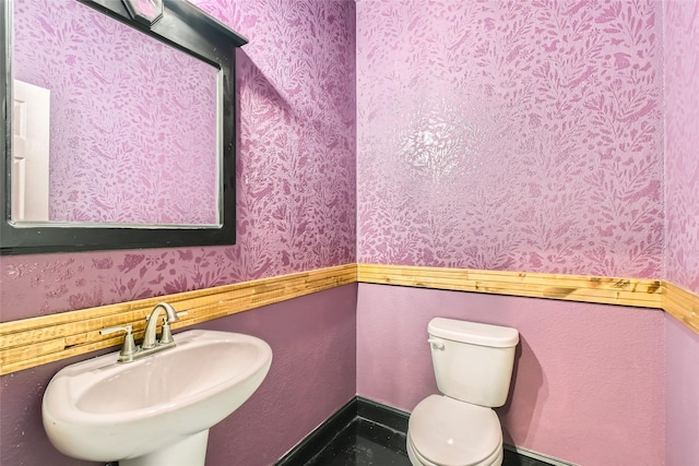 2001 Ryan Ct, Weatherford, TX 76085 - bathroom featuring wallpapered walls, a sink, and toilet