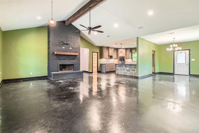 2001 Ryan Ct, Weatherford, TX 76085 - unfurnished living room with ceiling fan with notable chandelier, lofted ceiling with beams, a fireplace, concrete floors, and baseboards