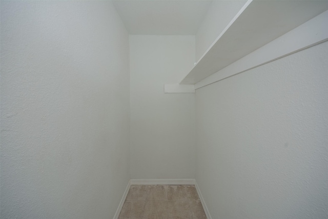 walk in closet featuring light tile patterned floors