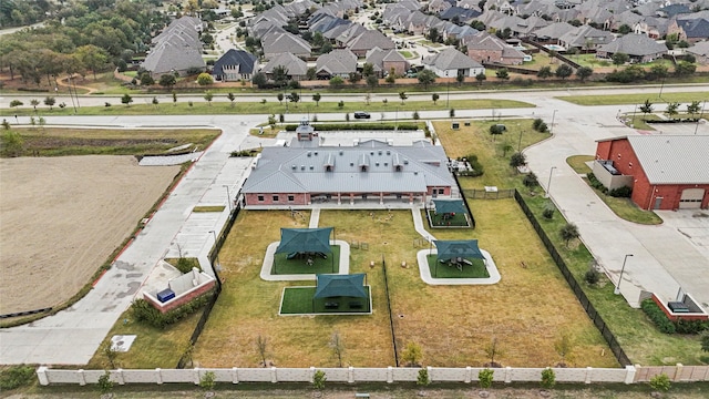 birds eye view of property with a residential view