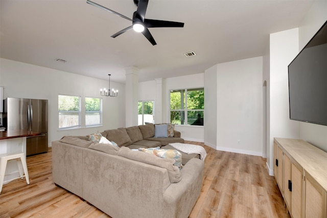 3945 Ringdove Way, Fort Worth, TX 76262 - living area featuring a chandelier, light wood-type flooring, a ceiling fan, and baseboards