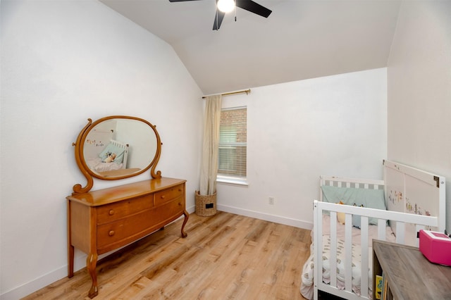 3945 Ringdove Way, Fort Worth, TX 76262 - bedroom with lofted ceiling, wood finished floors, a crib, baseboards, and a ceiling fan