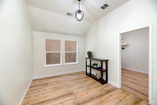 3945 Ringdove Way, Fort Worth, TX 76262 - unfurnished room with wood finished floors, vaulted ceiling, and baseboards