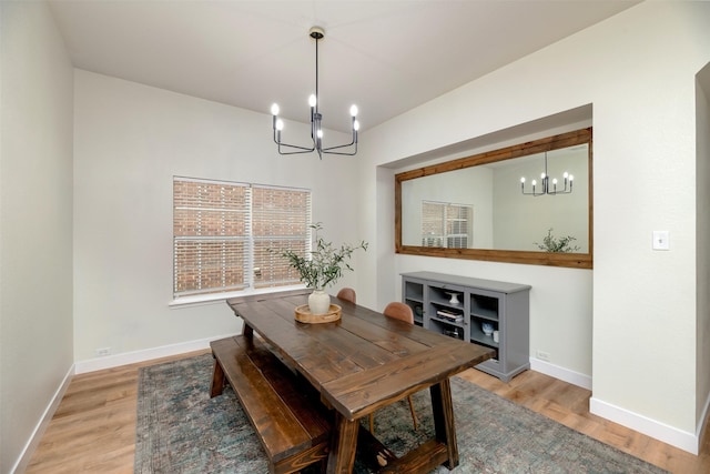 3945 Ringdove Way, Fort Worth, TX 76262 - dining room with a chandelier, light wood finished floors, and baseboards