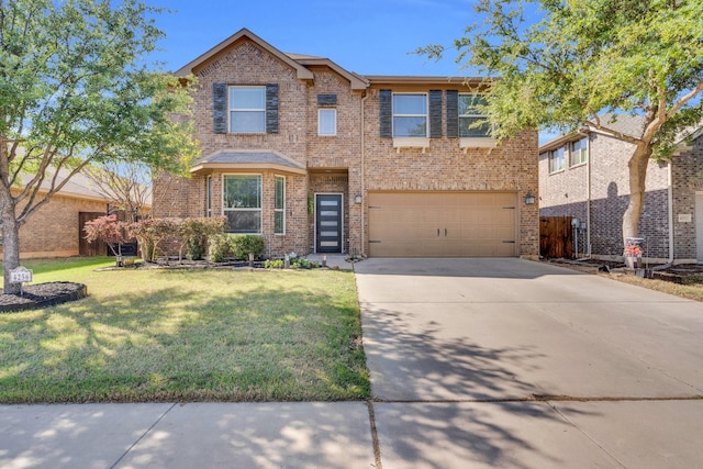 traditional-style home featuring brick siding, a front yard, a garage, and concrete driveway