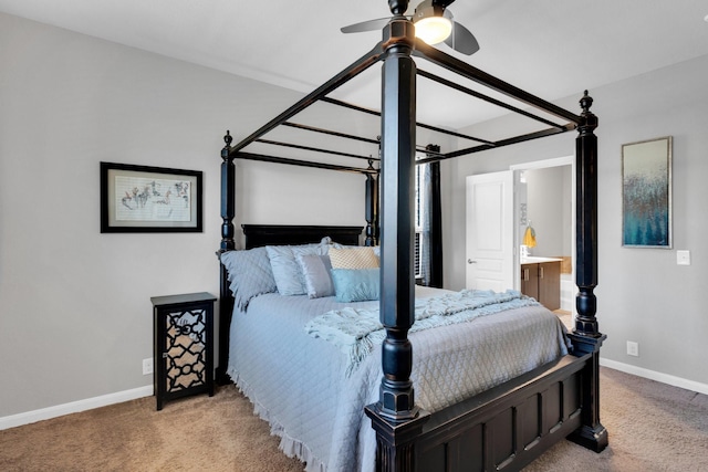 bedroom with light carpet, ensuite bathroom, and baseboards