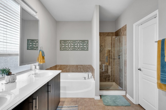 bathroom with a sink, a bath, a shower stall, and double vanity