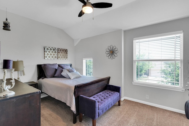carpeted bedroom with ceiling fan, baseboards, and vaulted ceiling