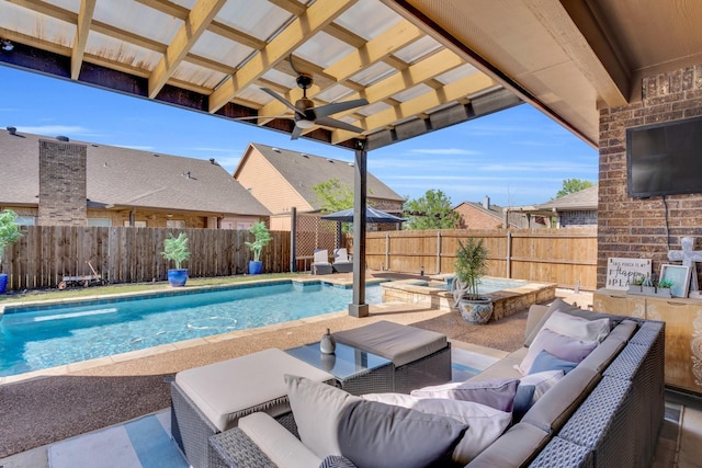 view of pool with an outdoor hangout area, a patio area, a fenced backyard, ceiling fan, and a pool with connected hot tub