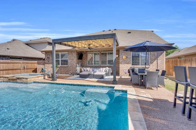 view of swimming pool with a fenced backyard, outdoor lounge area, an in ground hot tub, and a fenced in pool