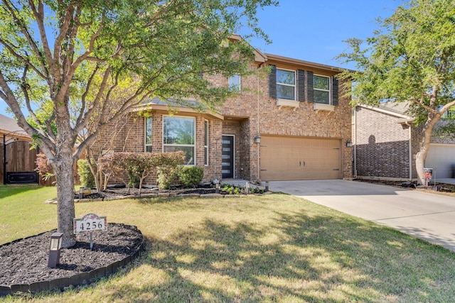 traditional home featuring a garage, a front yard, concrete driveway, and brick siding