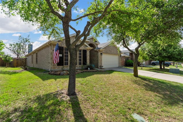 view of front of house featuring an attached garage, fence, brick siding, a front lawn, and driveway