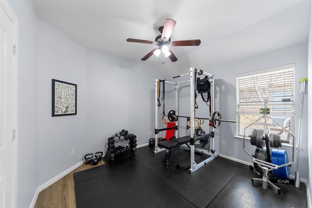 workout area with baseboards and a ceiling fan