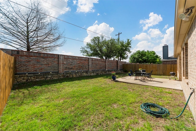 view of yard with a patio area and a fenced backyard