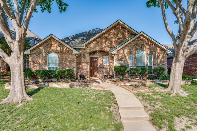 9133 Wichita Trl, Frisco, TX 75033 - view of front of property featuring a front lawn and brick siding