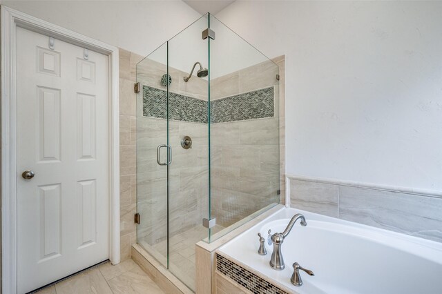 9133 Wichita Trl, Frisco, TX 75033 - full bath featuring a stall shower and a bath