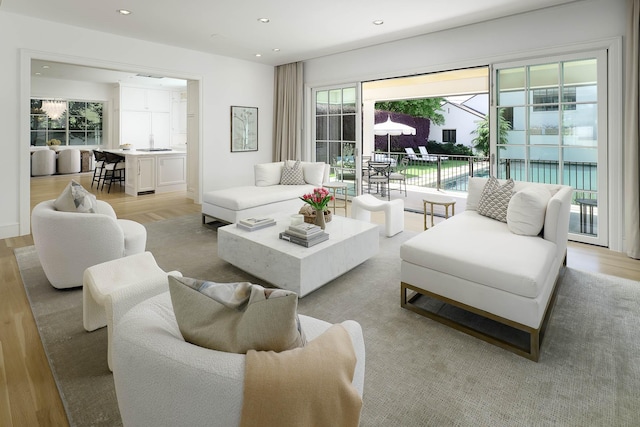 living area featuring recessed lighting and light wood-style floors