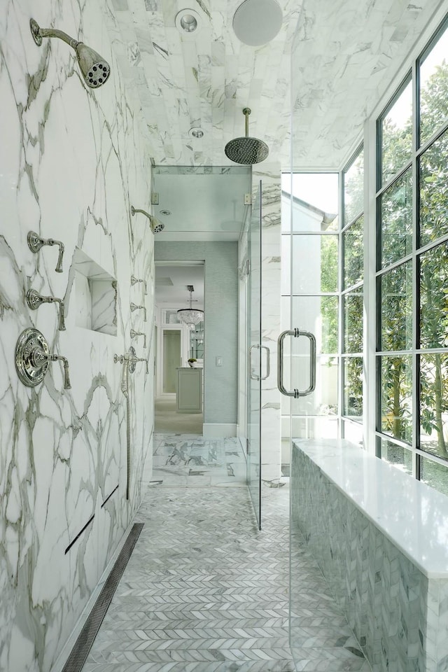 bathroom with a marble finish shower