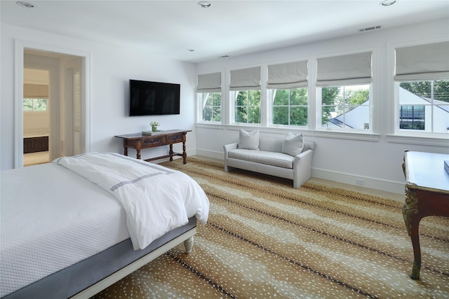 bedroom with baseboards, visible vents, and recessed lighting