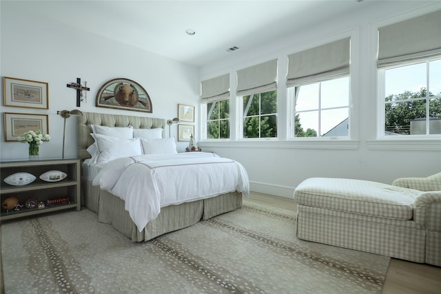 bedroom with visible vents and baseboards