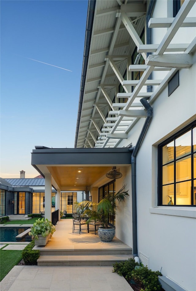 exterior space featuring stucco siding