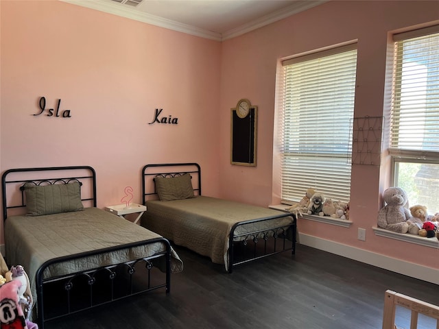 bedroom featuring crown molding, multiple windows, dark wood finished floors, and baseboards