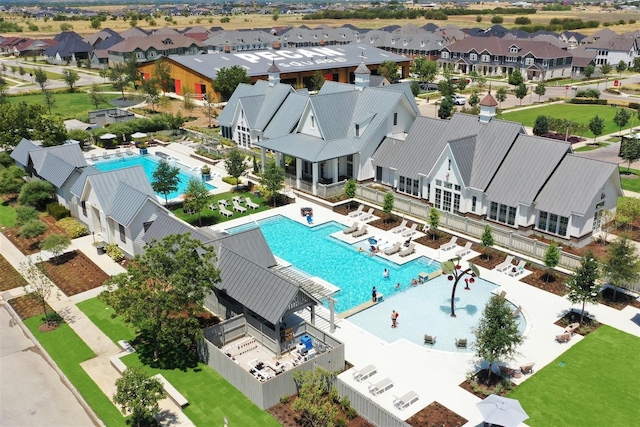 birds eye view of property with a residential view