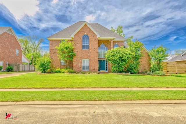 1231 Whitehall Dr, Bossier City, LA 71112 - view of front facade with roof with shingles, fence, a front lawn, and brick siding