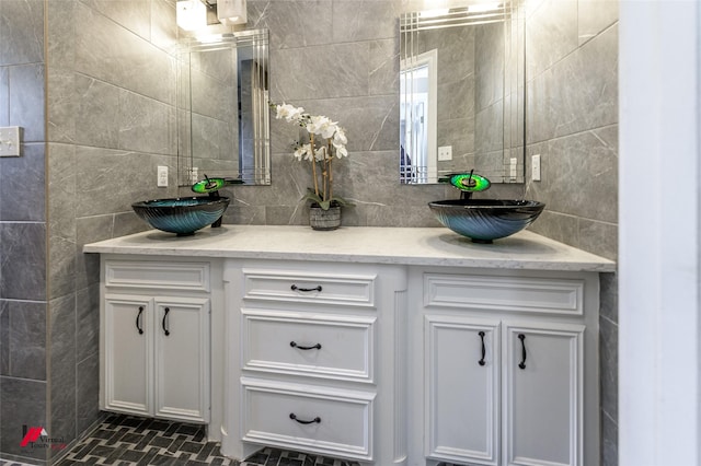 1231 Whitehall Dr, Bossier City, LA 71112 - bathroom with a sink, tile walls, and double vanity