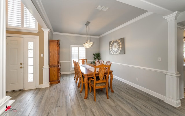 1231 Whitehall Dr, Bossier City, LA 71112 - dining space featuring ornamental molding, light wood-type flooring, ornate columns, and baseboards