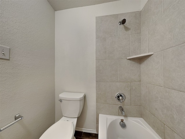 bathroom featuring shower / tub combination, baseboards, and toilet