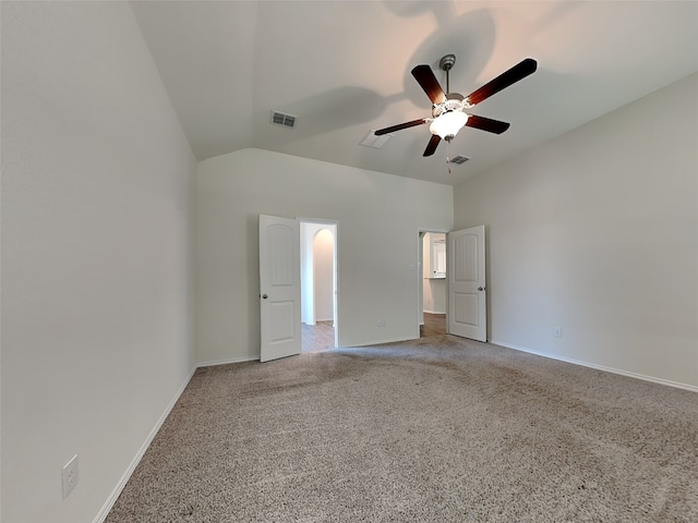 unfurnished bedroom with lofted ceiling, baseboards, carpet flooring, visible vents, and ceiling fan