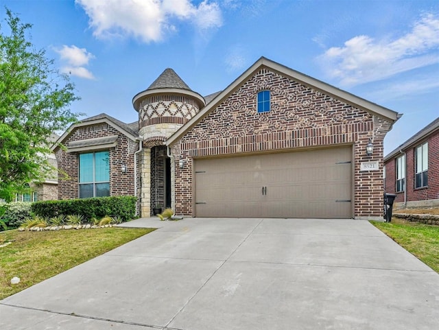 french country home with brick siding, driveway, and an attached garage