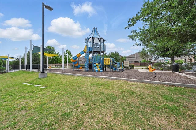 community play area featuring a lawn