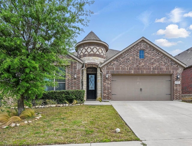 french provincial home with brick siding, a front yard, an attached garage, and concrete driveway