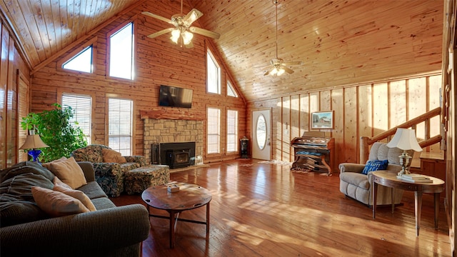 living room featuring high vaulted ceiling, a ceiling fan, and a healthy amount of sunlight