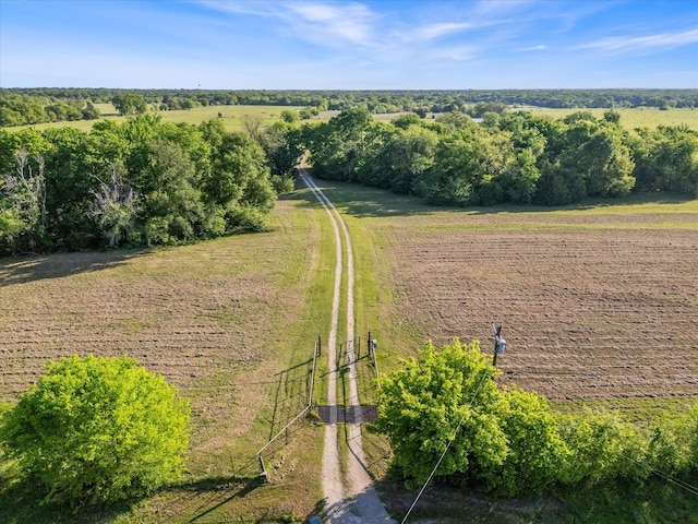 birds eye view of property featuring a rural view