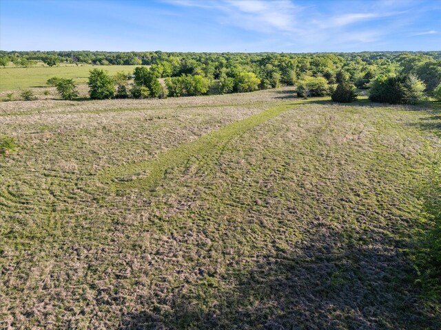birds eye view of property featuring a rural view