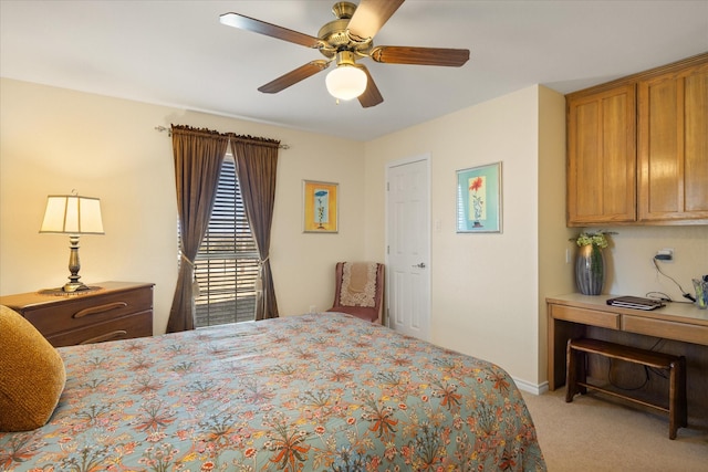 bedroom with baseboards, a ceiling fan, and light colored carpet
