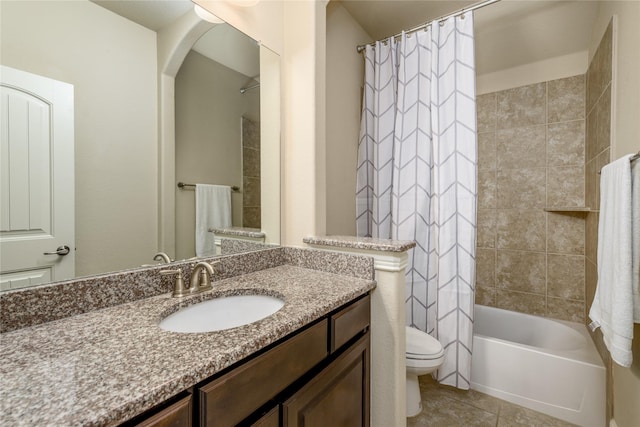 bathroom with toilet, vanity, tile patterned floors, and shower / bathtub combination with curtain