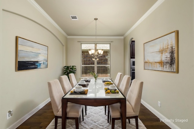 dining room with baseboards, dark wood-style flooring, a chandelier, and visible vents